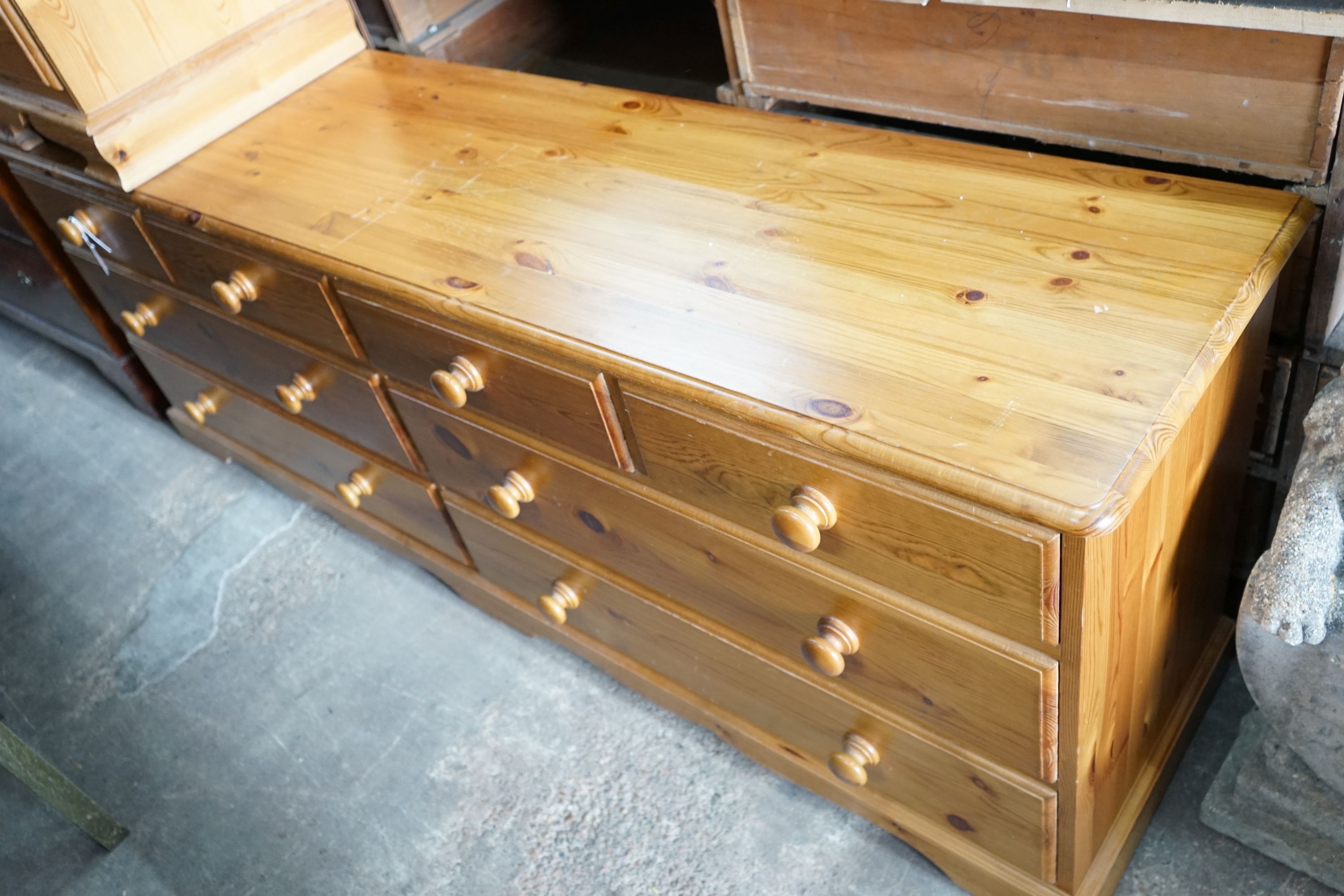 A modern pine double chest, width 192cm, depth 44cm, height 71cm and a similar two drawer bedside chest